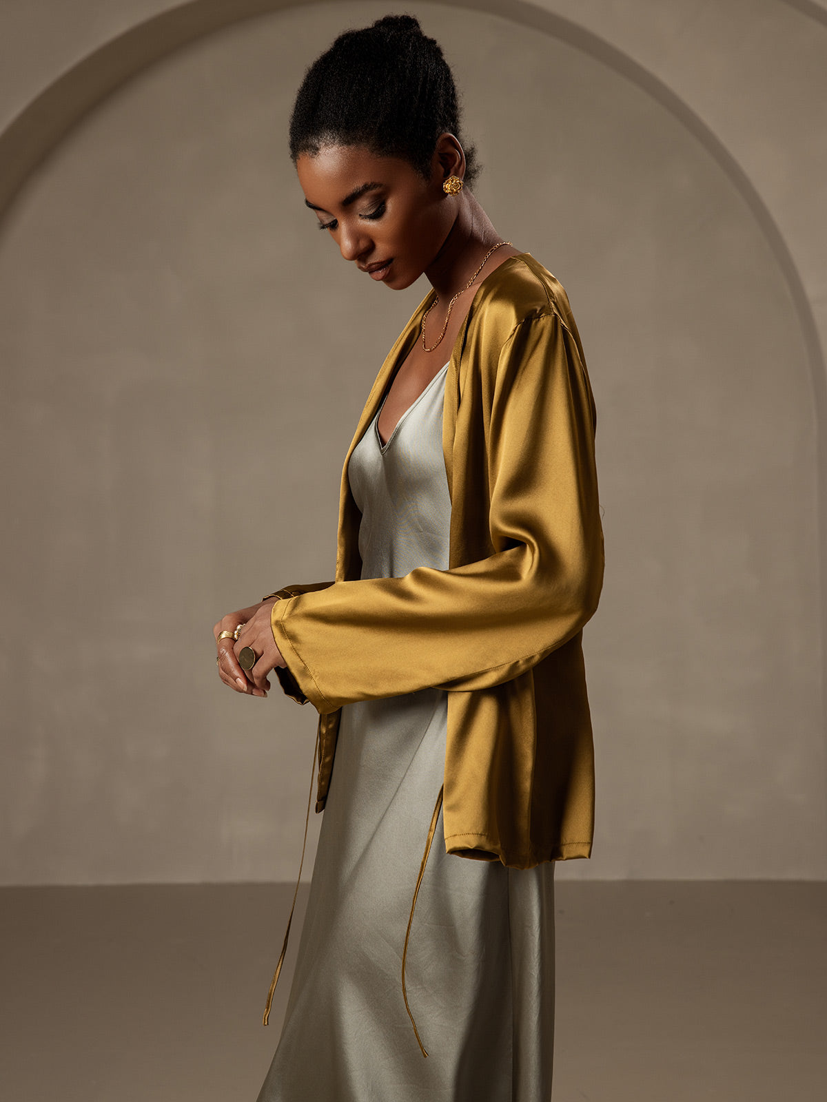 Brown 19Momme mulberry silk relaxed long sleeve tie-front cardigan for women, worn over a slip dress.