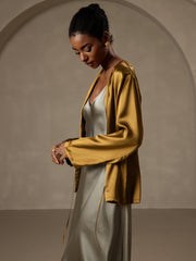 Brown 19Momme mulberry silk relaxed long sleeve tie-front cardigan for women, worn over a slip dress.