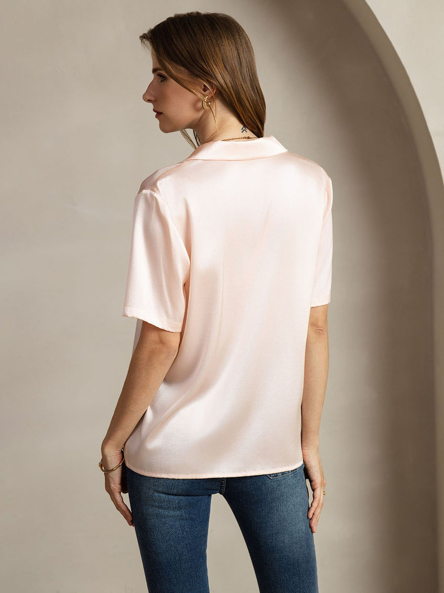 Women's pink 19 Momme mulberry silk short sleeve notched lapel shirt with button-up design.