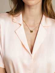 Pink 19Momme mulberry silk short sleeve notched lapel women's shirt with button-up design.
