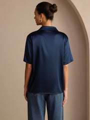 Women's navy blue mulberry silk short sleeve shirt with notched lapel and button-up design.