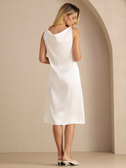 White 19 Momme mulberry silk sleeveless cowl neck knee dress on a woman.