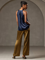 Women's navy 19 Momme mulberry silk sleeveless halter neck top with gold wide-leg pants.