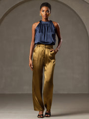 Women's navy mulberry silk sleeveless halter neck top with gold silk wide-leg pants.