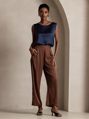 Women's navy 19Momme mulberry silk sleeveless round neck tank top with brown wide-leg pants.