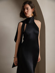 Black 19 Momme mulberry silk sleeveless midi dress with tie neck, worn by a woman.