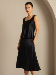 Black 19 Momme mulberry silk sleeveless U-neck tank top and matching skirt on a woman.