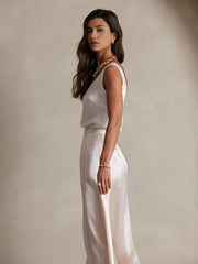 White 19 Momme mulberry silk sleeveless U-neck tank top and matching skirt on a woman.