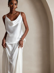 White 19 Momme mulberry silk spaghetti strap cowl neck camisole top on a model.