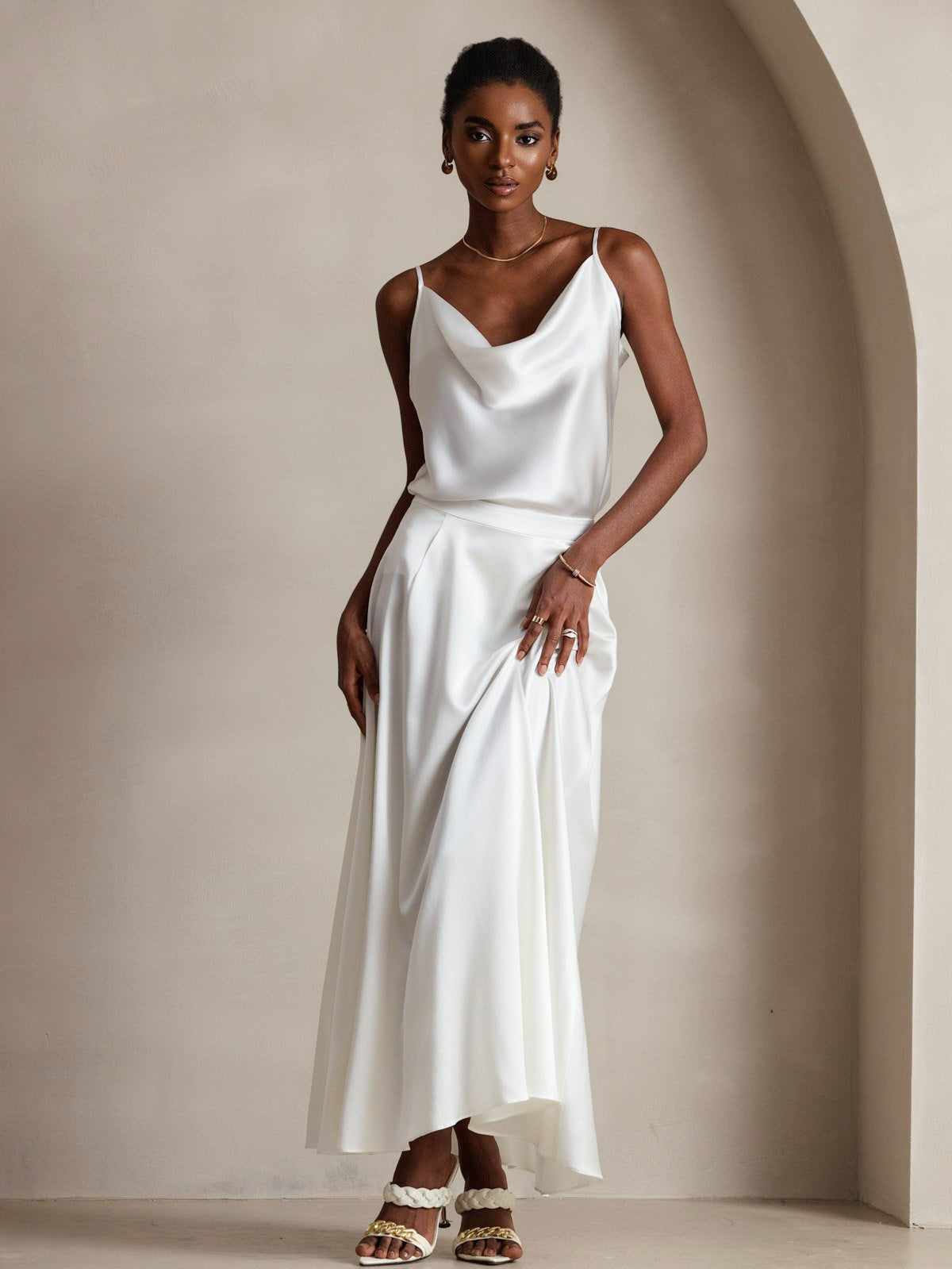 White 19 Momme mulberry silk spaghetti strap cowl neck camisole top and matching skirt.